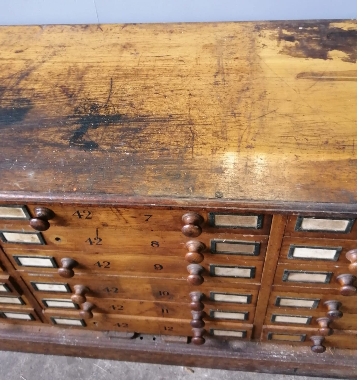 A large Victorian oak geological specimen cabinet, fitted 18 drawers with side locking bars, width 183cm, depth 63cm, height 77cm